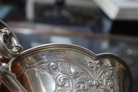 A late Victorian embossed silver two-handled shaped oval bowl, London, 1900, 18.5 oz.